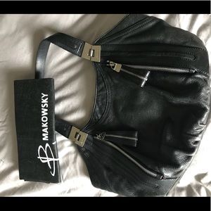 B. Makowsky black leather handbag